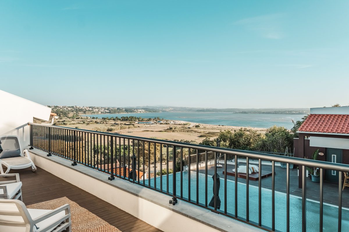 The balcony, the pool below it and the sea beyond