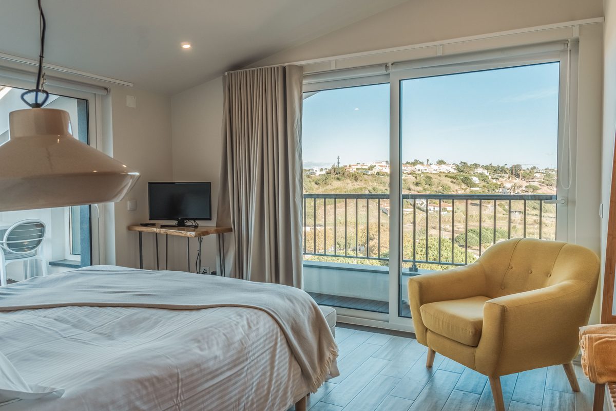 Double bed facing the window and the view