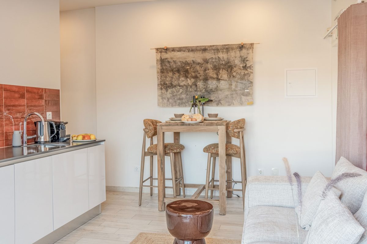 Kitchen with a bar counter and stools