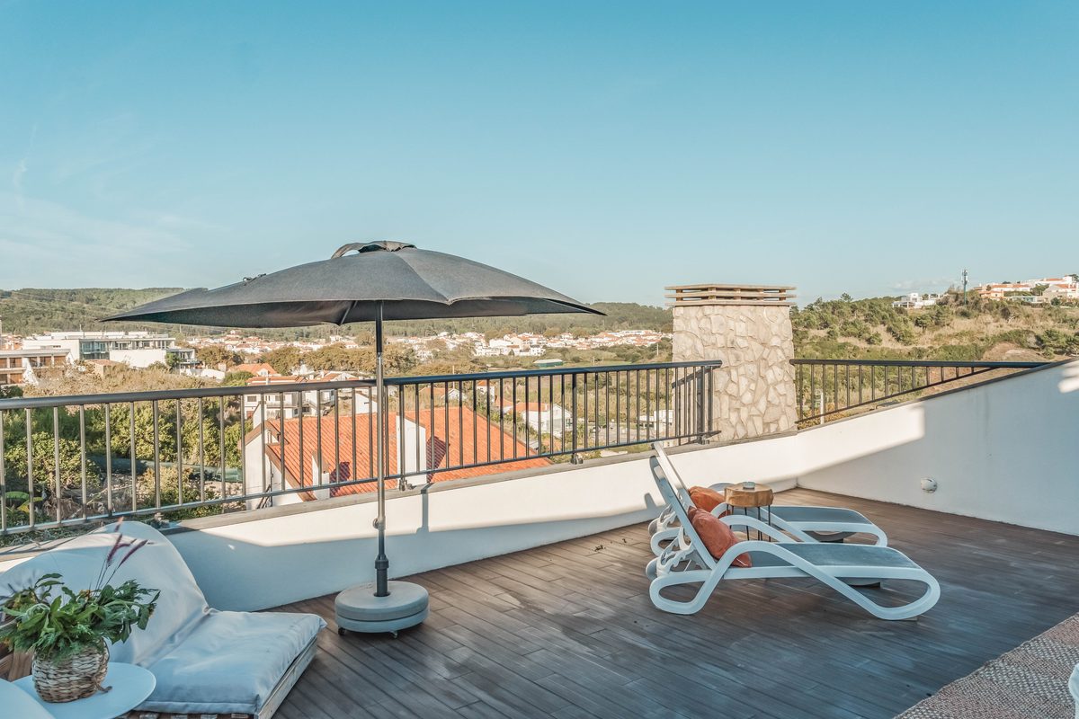 The roof terrace, looking out across the roofs to the hills